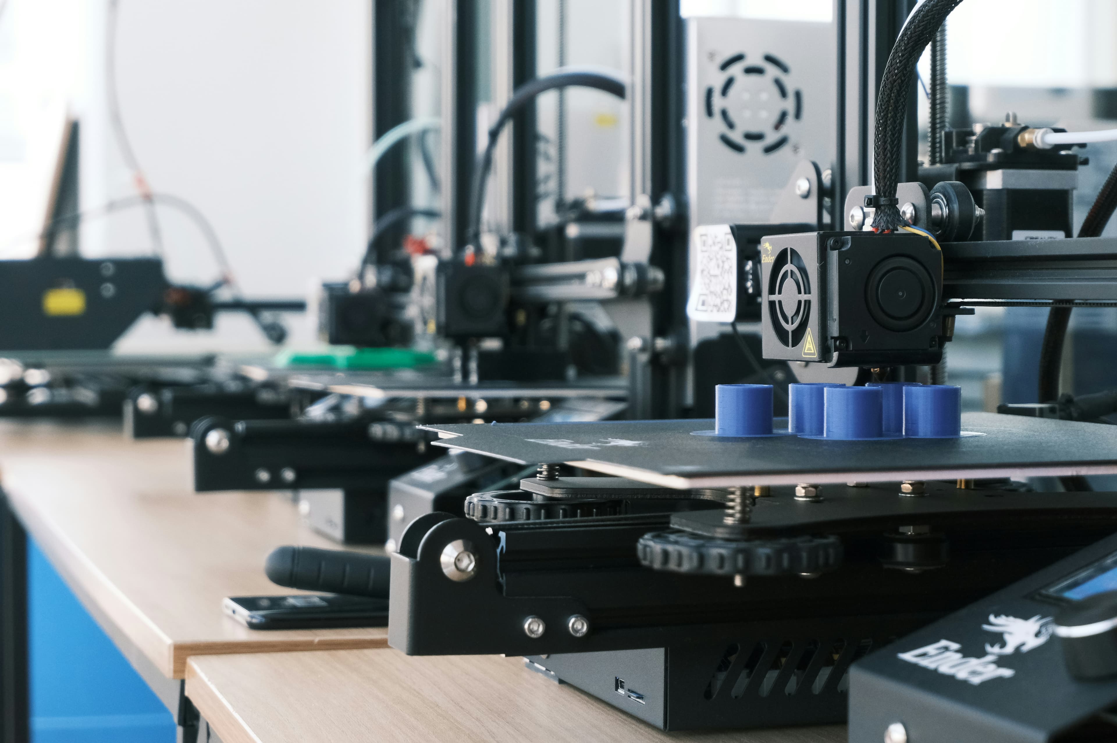 A workshop 3D printer mid-print